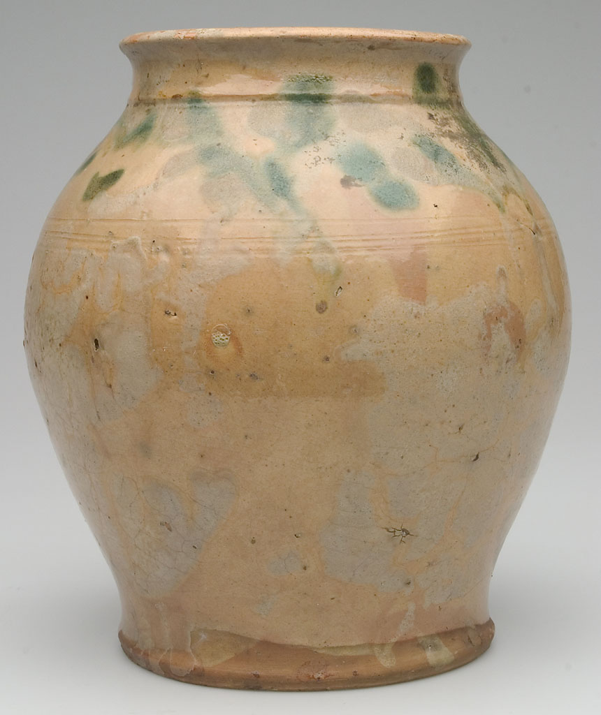 PETER BELL (ATTRIBUTED), HAGERSTOWN, MARYLAND OR WINCHESTER, SHENANDOAH VALLEY OF VIRGINIA LEAD AND COPPER GLAZE OVER A LIGHT SLIP WASH EARTHENWARE / REDWARE OVOID JAR