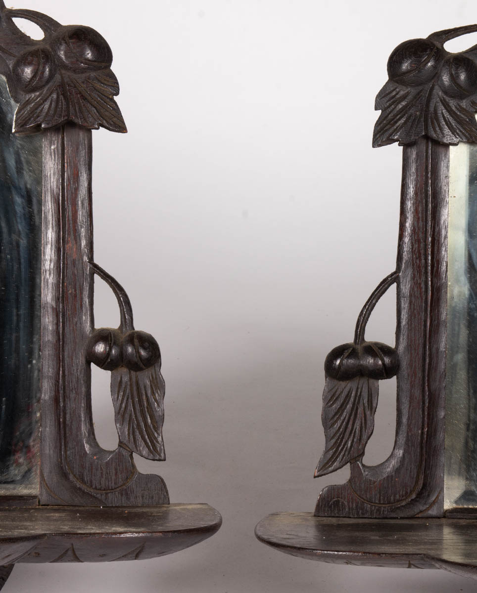 PAIR OF JOHN BELLAMY-STYLE FOLK ART CARVED AND PAINTED FIGURAL MIRRORS