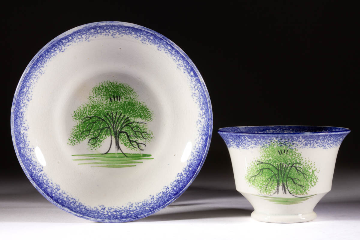 ENGLISH SPATTERWARE TREE CERAMIC CUP AND SAUCER SET
