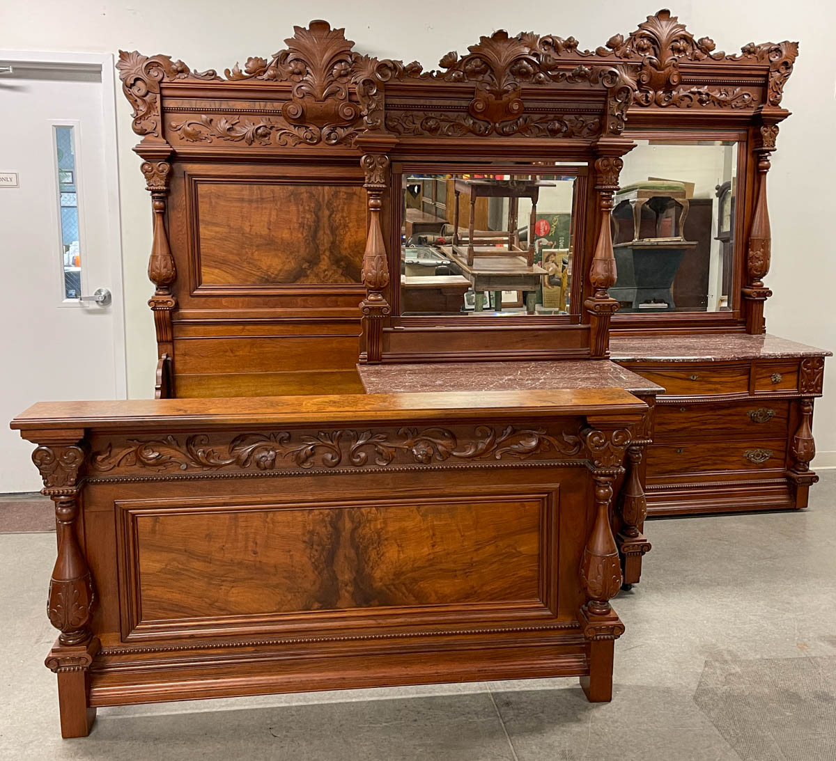 OUTSTANDING AMERICAN VICTORIAN CARVED WALNUT MARBLE-TOP MONUMENTAL THREE-PIECE BEDROOM SUITE