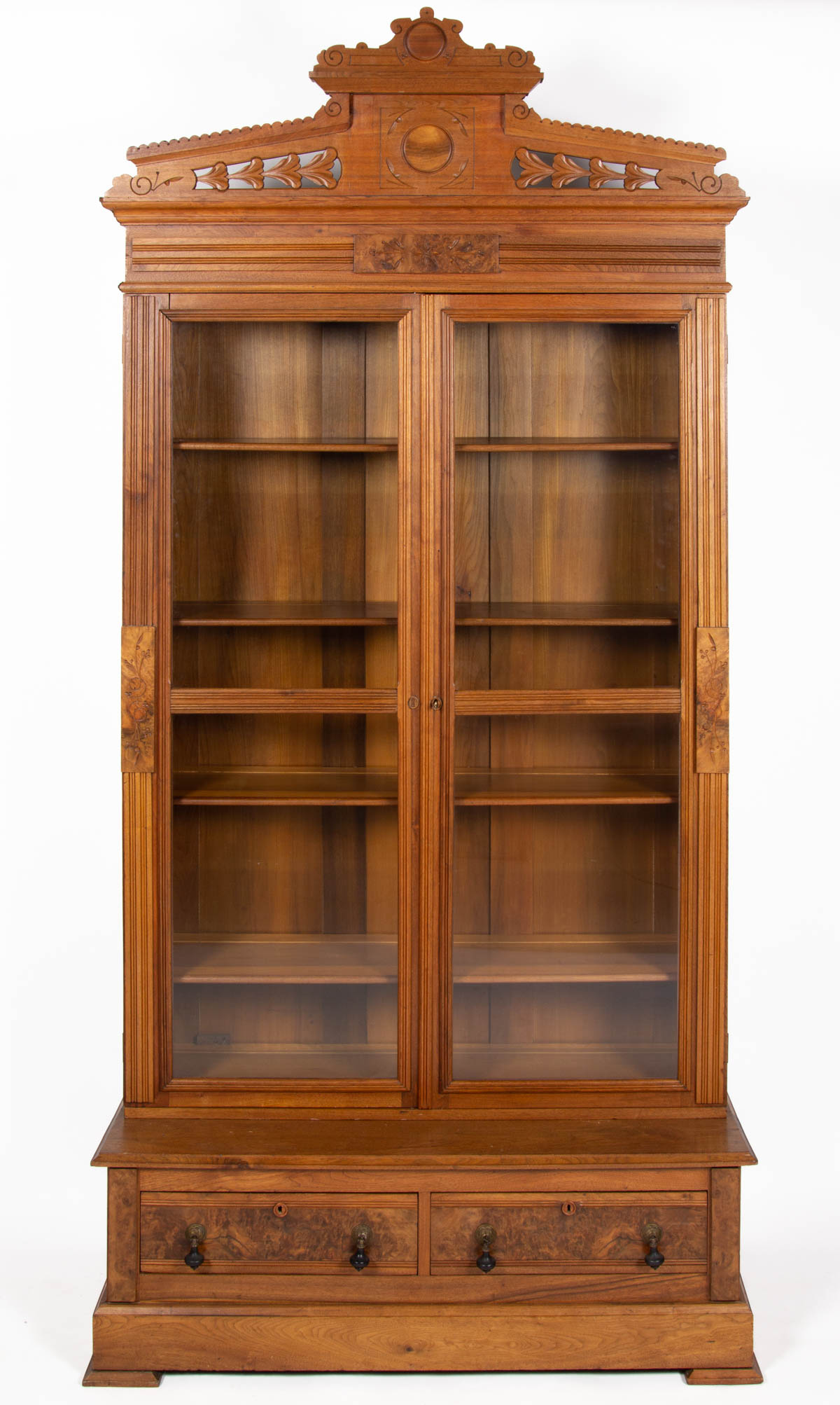 AMERICAN VICTORIAN CARVED WALNUT STEP-BACK BOOKCASE