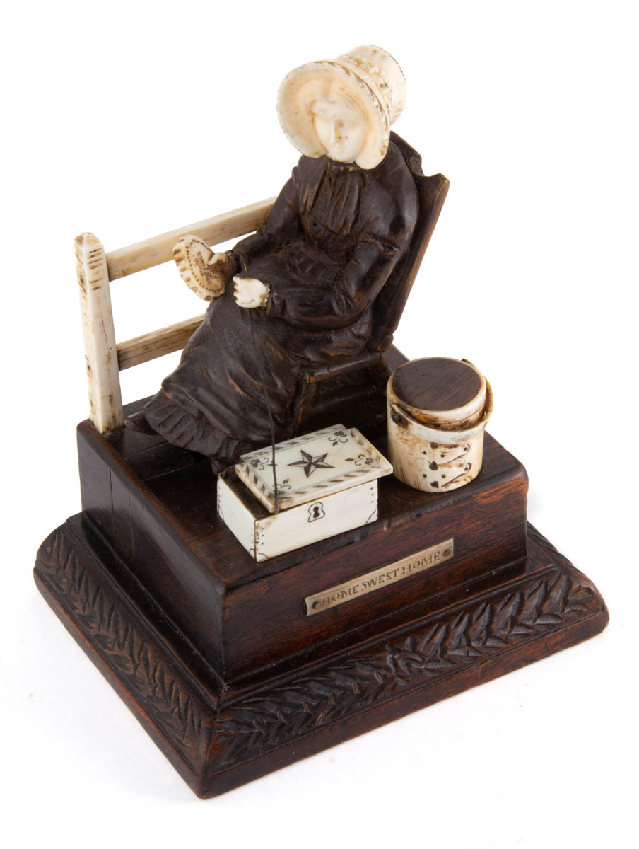 AMERICAN CARVED WOOD AND BONE FIGURAL SEWING AUTOMATON