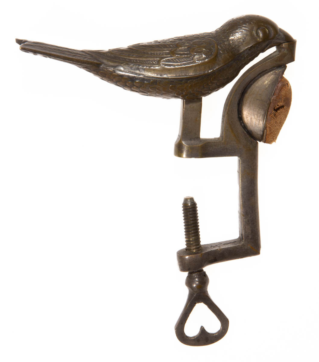 A. GEROULD STAMPED AND CAST-METAL FIGURAL SEWING BIRD CLAMP WITH PINCUSHION HOLDER