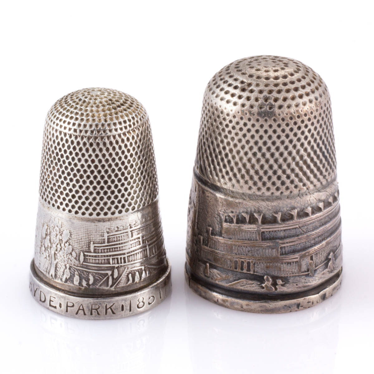 ENGLISH THE CRYSTAL PALACE COMMEMORATIVE SILVER SEWING THIMBLES, LOT OF TWO