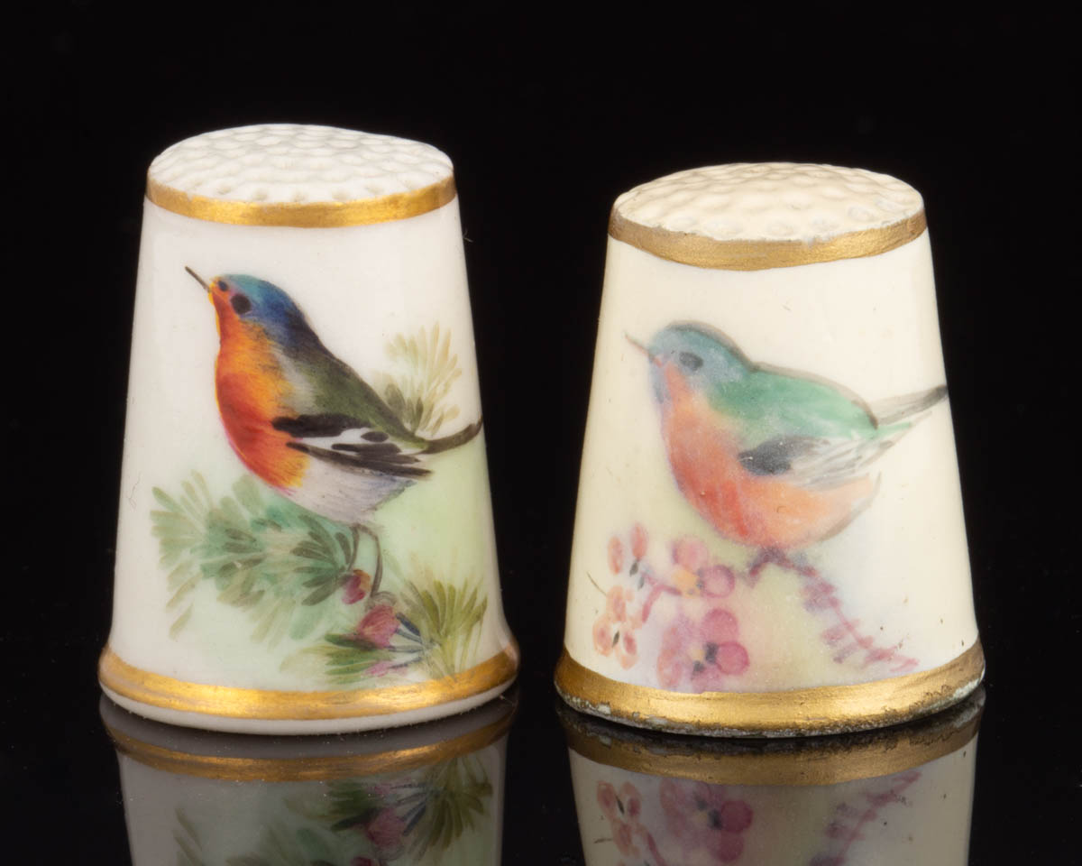 ENGLISH ROYAL WORCESTER BIRD MOTIF PORCELAIN SEWING THIMBLES, LOT OF TWO