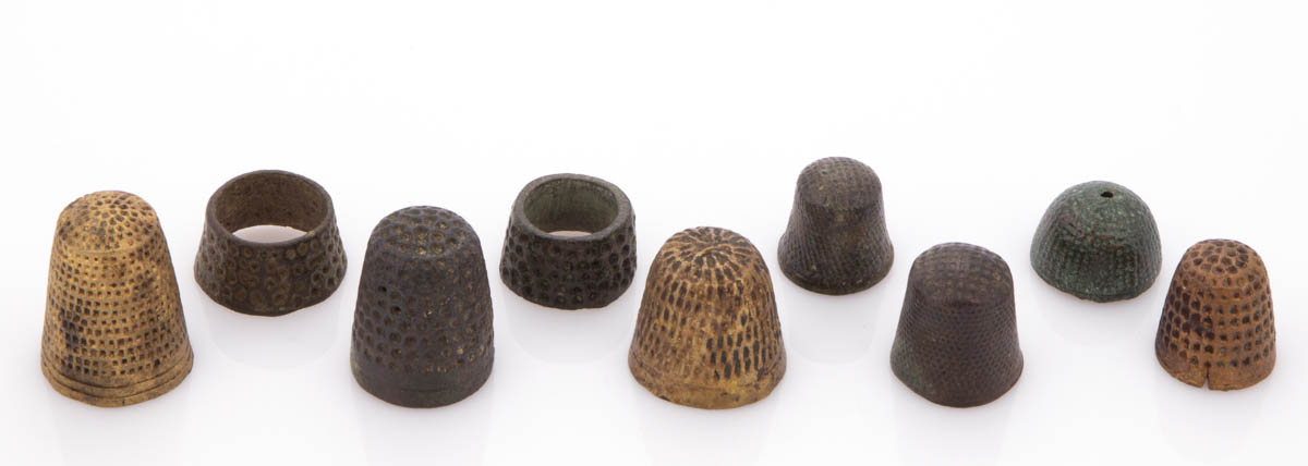 ASSORTED ARCHAEOLOGICAL BRASS / BRONZE SEWING THIMBLES, LOT OF NINE