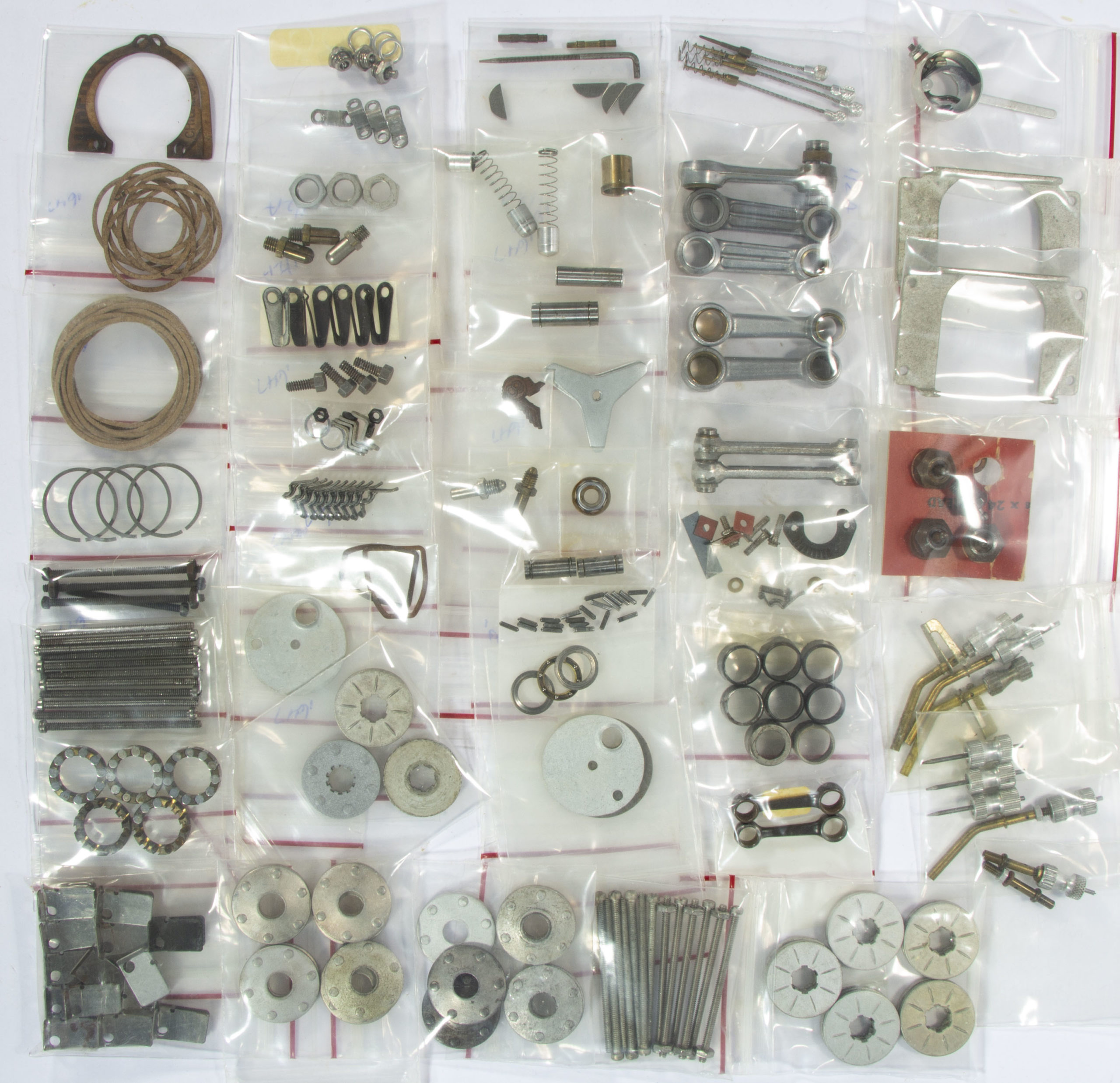 OHLSSON & RICE (O & R) ASSORTED MODEL AIRPLANE ENGINES AND PARTS, UNCOUNTED LOT,