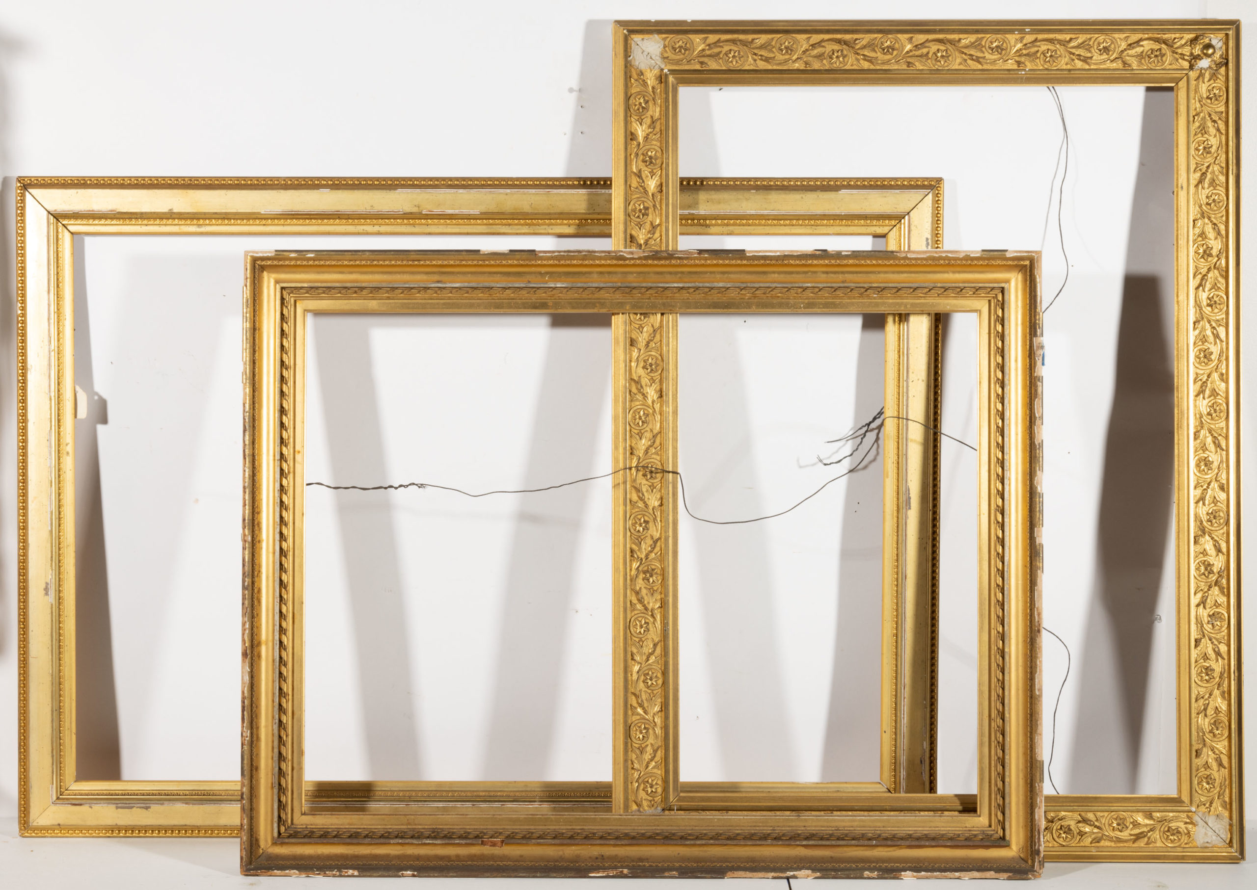 ANTIQUE MOLDED-GILT AND GESSO PICTURE FRAMES, LOT OF THREE,