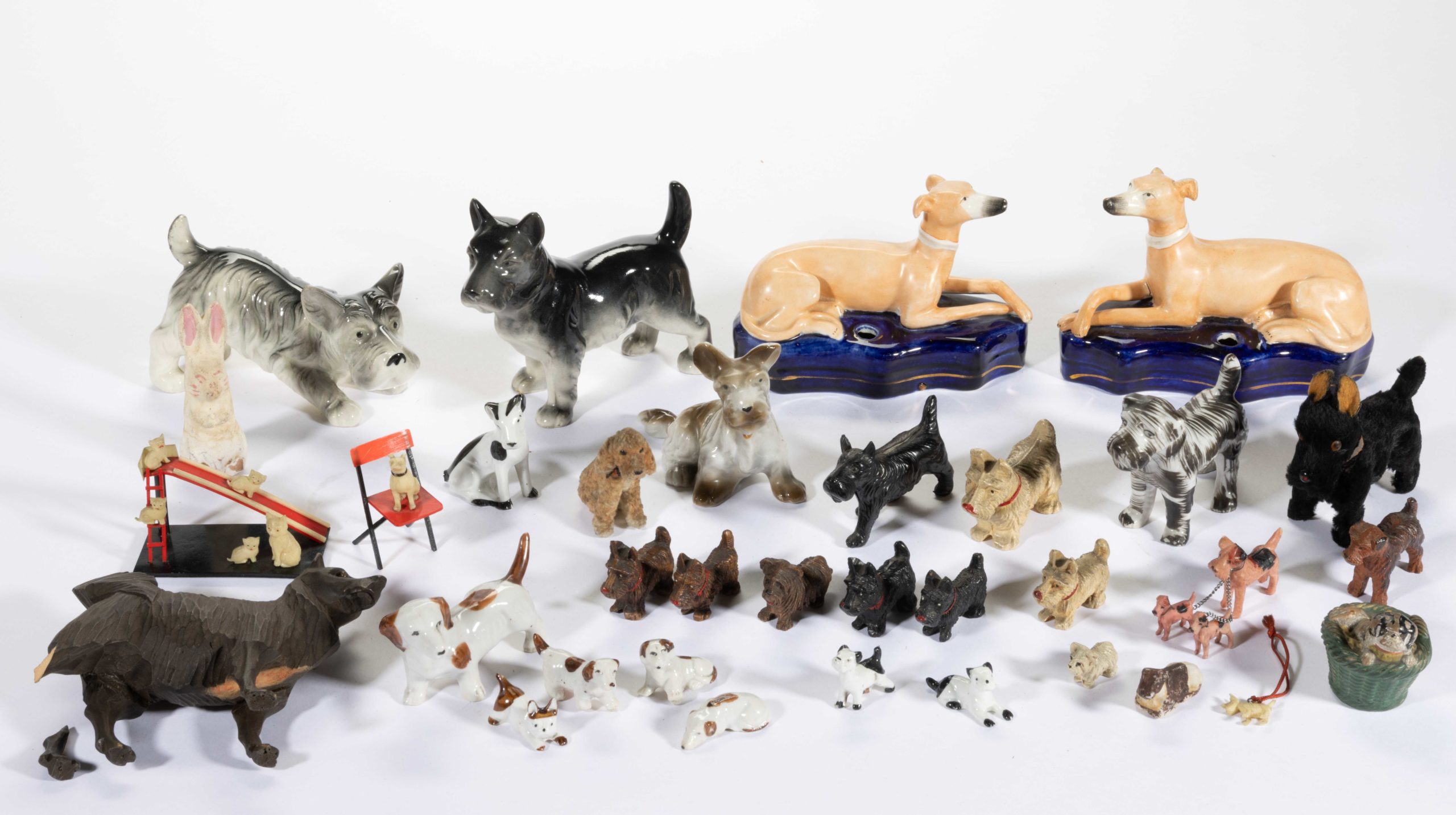 ASSORTED MINIATURE FIGURAL DOGS, LOT OF 34 +/-,