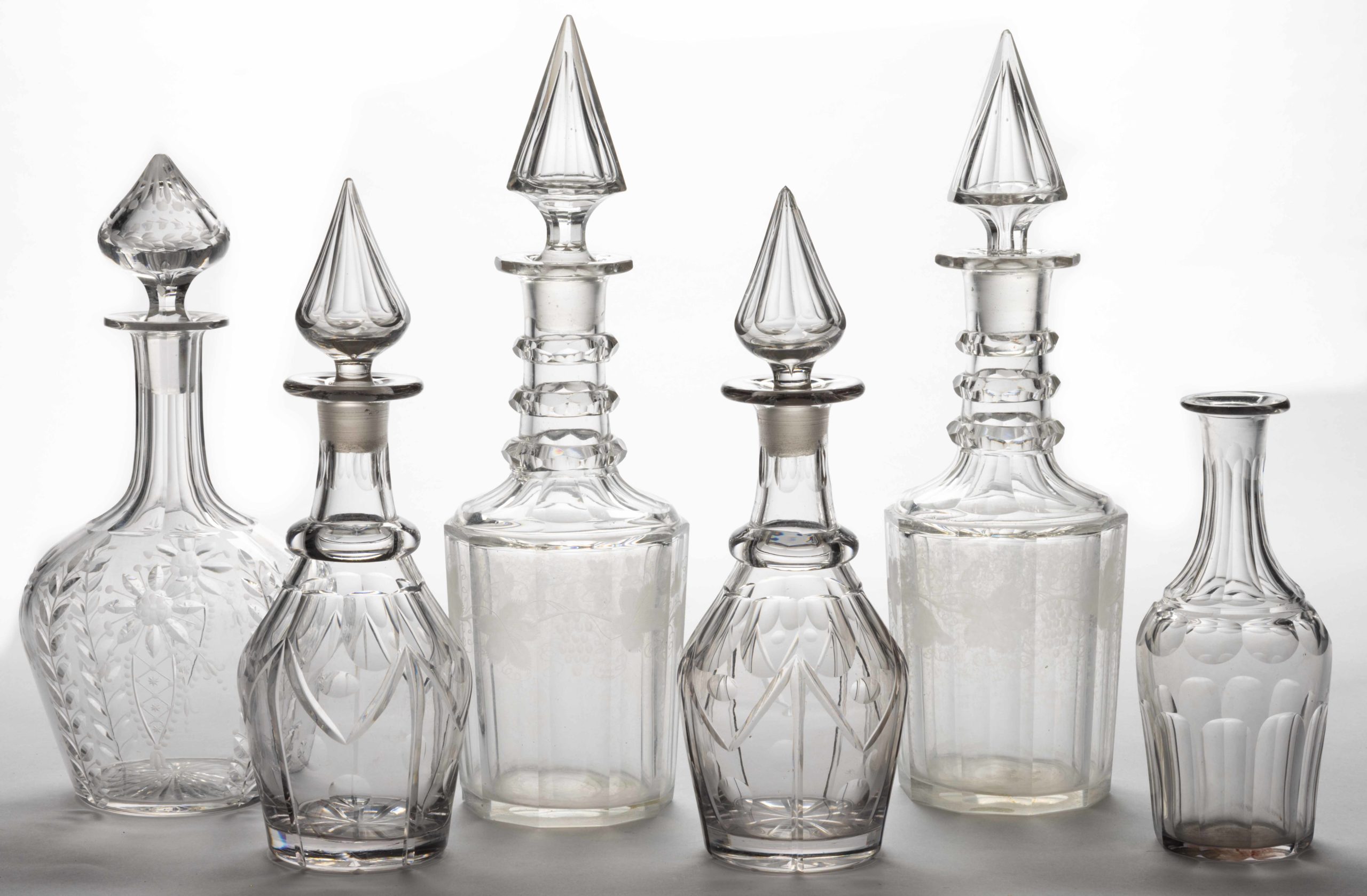 ASSORTED CUT / ENGRAVED GLASS DECANTERS, LOT OF SIX,