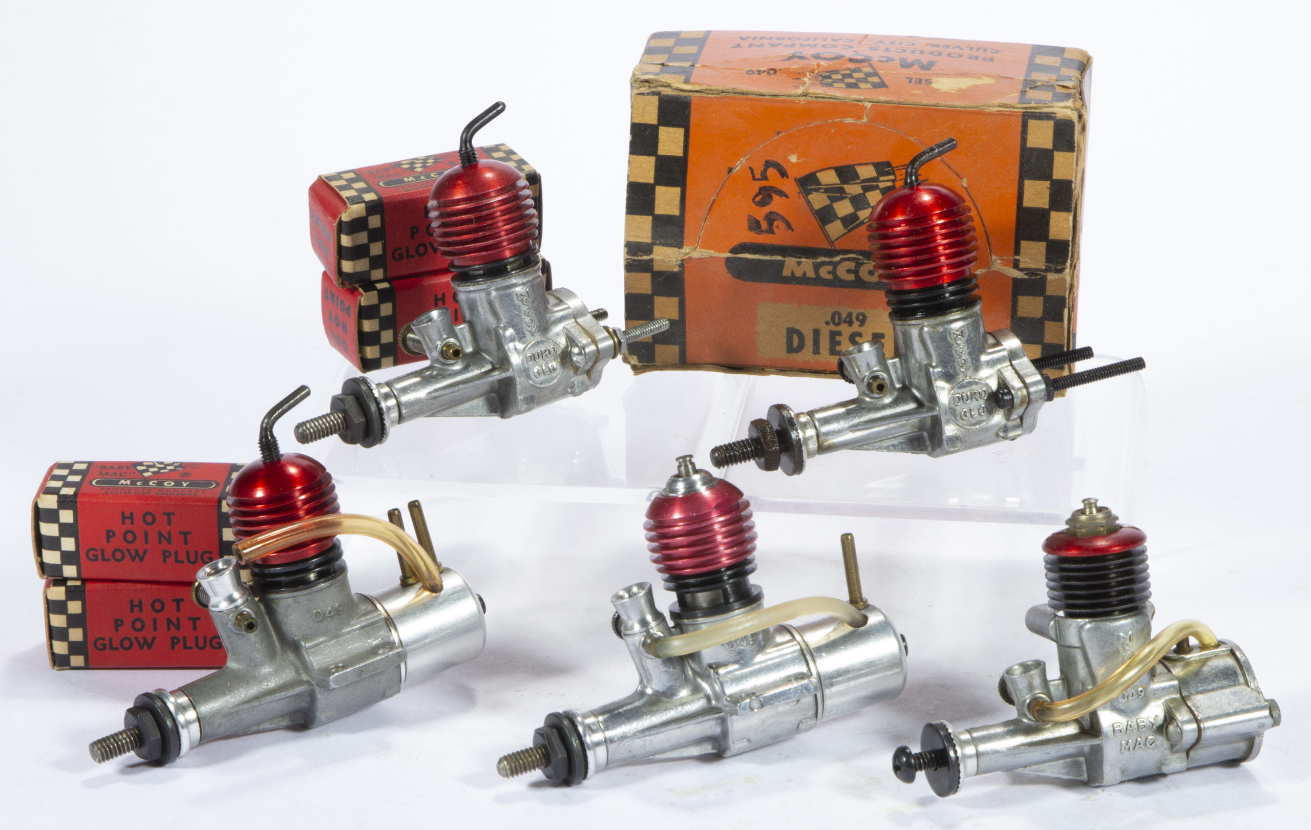 DURO-MATIC / MCCOY PRODUCTS CO. “MCCOY” ASSORTED DIESEL AND GLOW PLUG MODEL AIRPLANE ENGINES AND PARTS, LOT OF APPROXIMATELY 17,